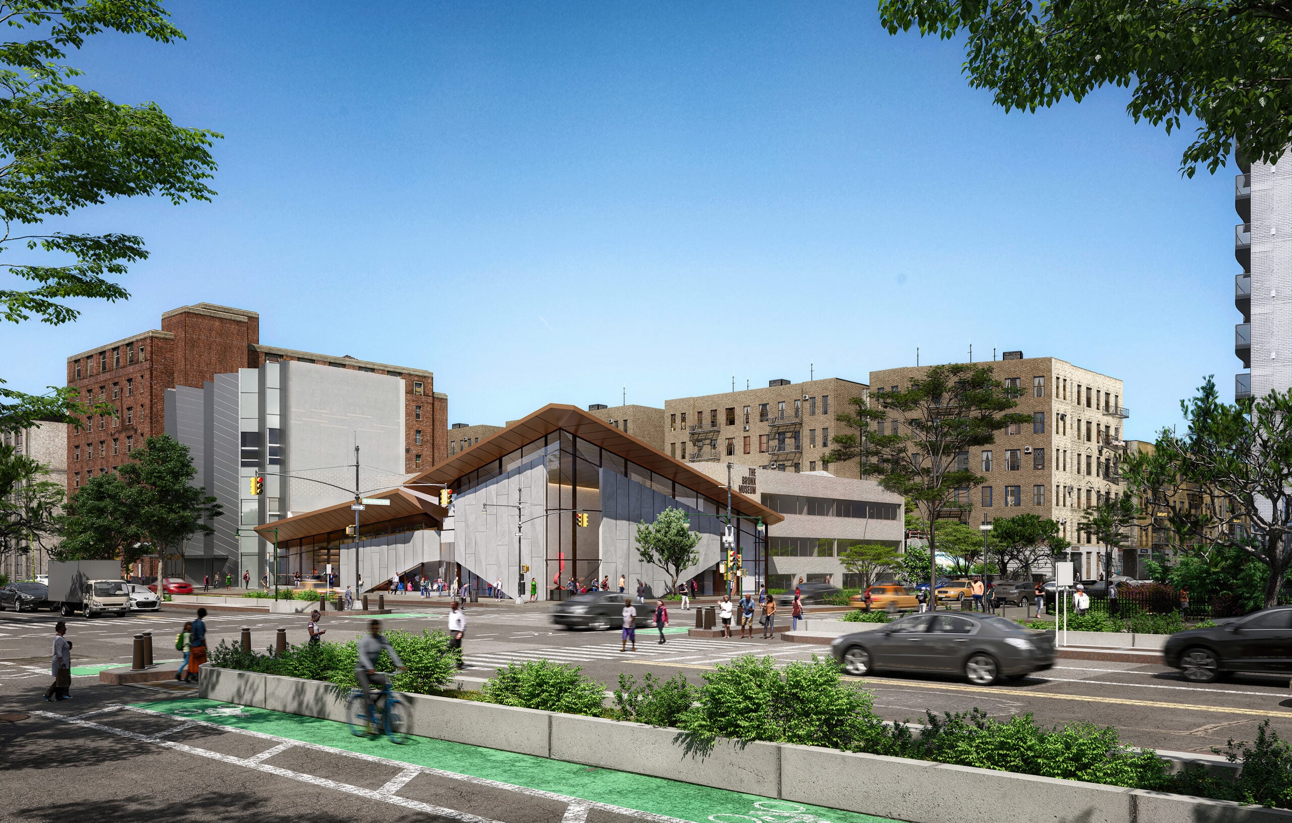 Rendering of the new Grand Concourse entrance of The Bronx Museum. A modern building with a sloped roof sits at a busy urban intersection, surrounded by trees, parked cars, apartment buildings, cyclists, and pedestrians under a clear blue sky. Courtesy of Marvel.