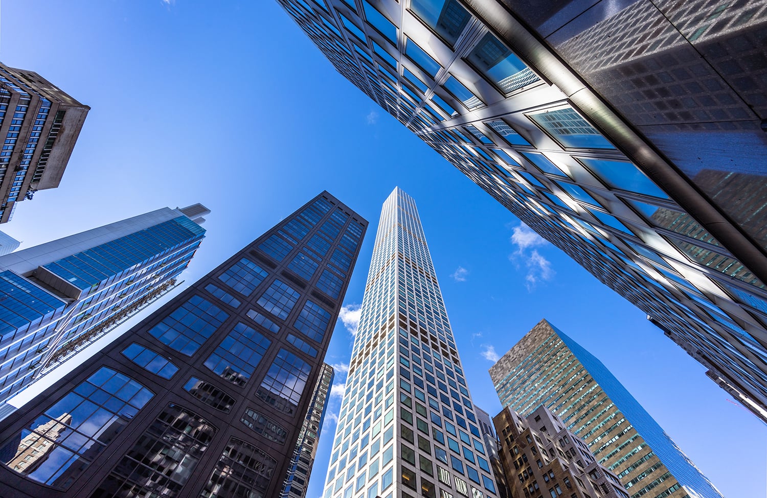 This view from West 57th Street in Midtown Manhattan looks up at the tall buildings along the street. Some of the buildings seen here are 425 Park Avenue, 450 Park Avenue, 460 Park Avenue and 432 Park Avenue.