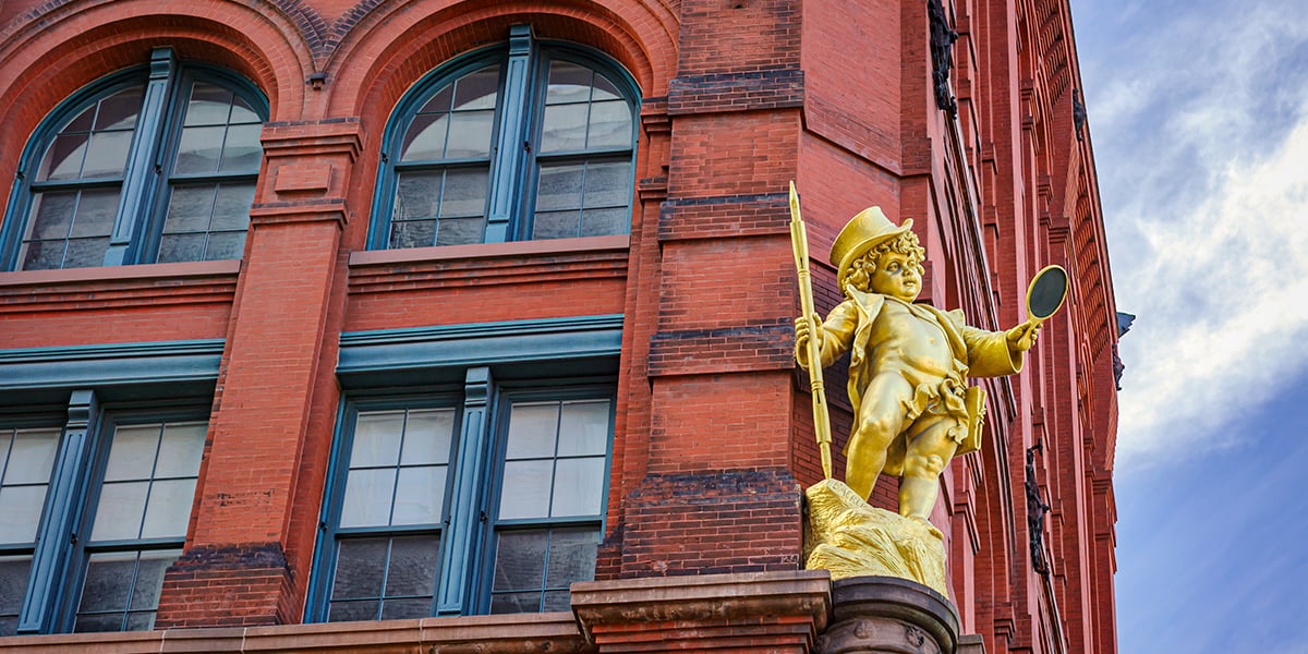 A gilded statue of William Shakespeare's character Puck, from A Midsummer Night's Dream, by sculptor Henry Baerer decorates the historic Puck Building. The Puck Building built in 1892 is located in the NoLita neighborhood of Manhattan, New York City. It occupies the block bounded by Lafayette, Houston, Mulberry and Jersey Streets.