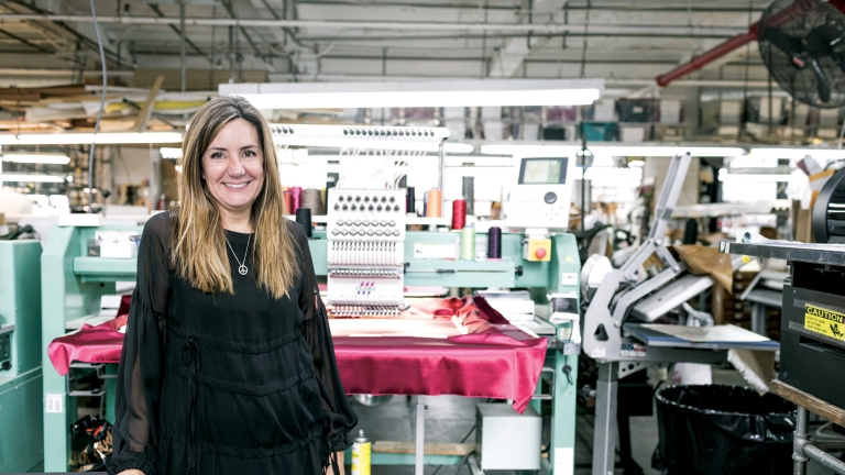 Woman in garment studio. Photo by Mac Shafer/NYCEDC