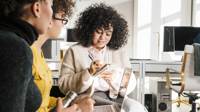 Female colleagues meeting in an office Female colleagues meeting in an office