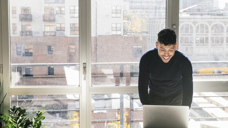 Businessman working on laptop in office