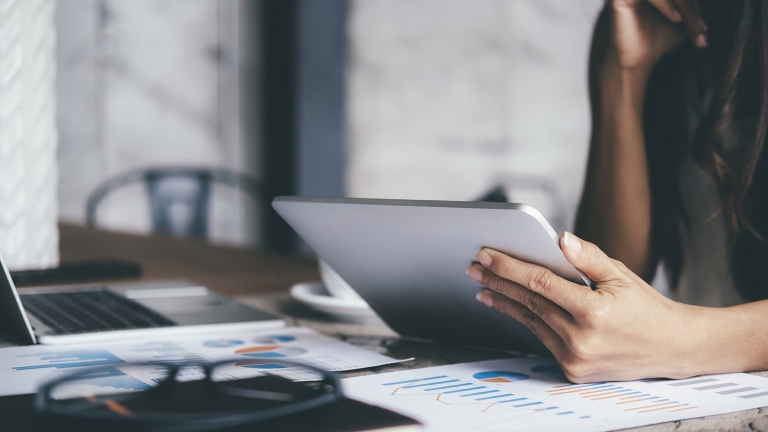 Businesswoman analyzing investment marketing data Businesswoman analyzing investment marketing data