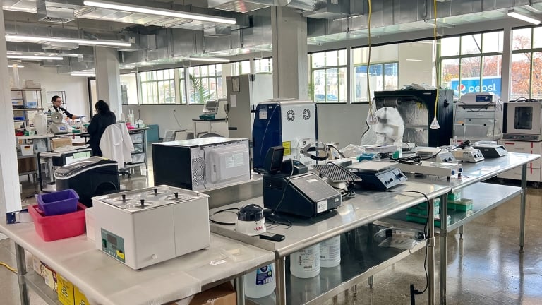 Two technicians working in the Aanika Biosciences Lab