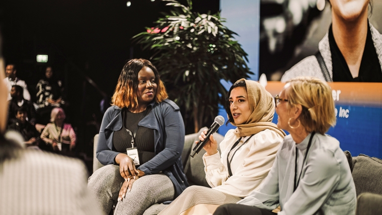 Three Women.NYC Network advisors speaking at a panel event.