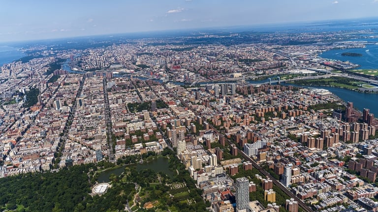 Aerial view of Central Park, Manhattan, and Harlem, and The Bronx in a distance behind, from a helicopter on a sunny summer day.