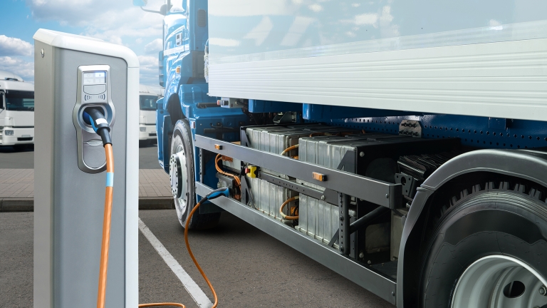 Conceptual rendering of electric truck batteries charging from the charging station.