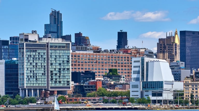 The Standard, High Line Hotel, left, and the Whitney Art Museum, in the West Village and Meatpacking District in lower Manhattan, NYC are seen from the Hudson River. The Whitney building was designed by Renzo Piano and its location marks the southern entrance to the High Line park.