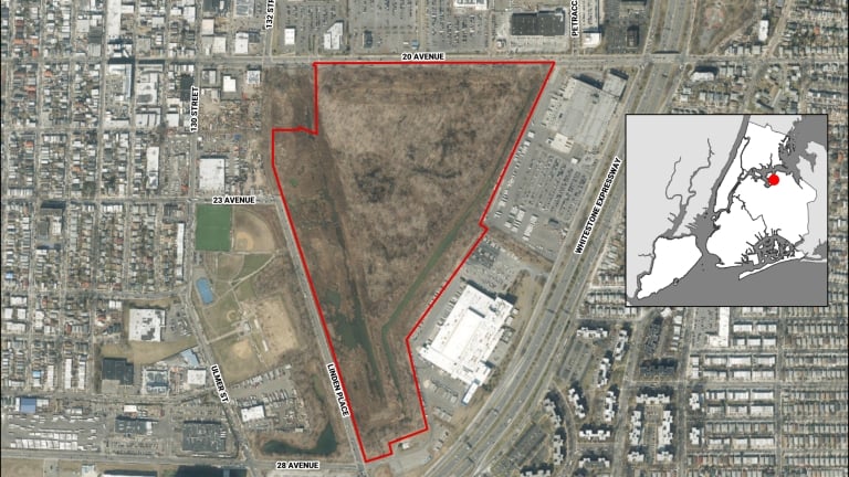 Aerial view of former Flushing Airport with a large, triangular, brown patch outlined in red. Inset map shows location in New York City. Roads and buildings surround the outlined area.