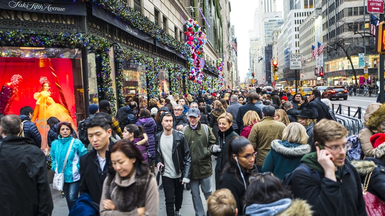 Christmas shoppers filling the sidewalks of Fifth Avenue with just two days of Christmas shopping before the holiday.