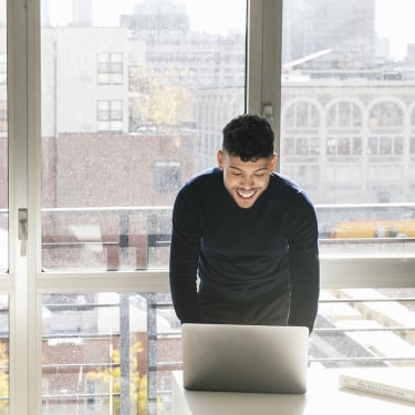 Businessman working on laptop in office