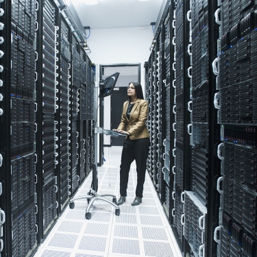 Business person working in a server room