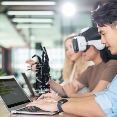 Women and men learn computer robot innovations.