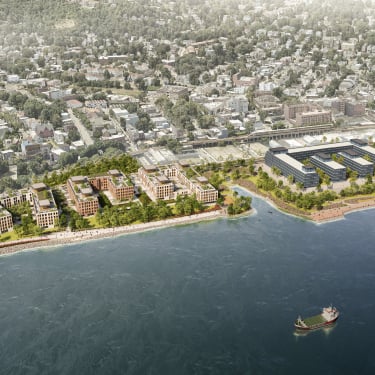 Aerial rendering of North Shore Staten Island with modern buildings, green spaces, and a walking path along the shore. A cargo ship sails on the water, and a residential area with tree-lined streets is visible in the background.