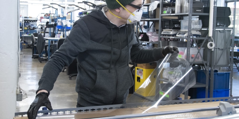 A worker at NYC-based tech company Adafruit makes a face shield during the coronavirus pandemic in 2020. Adafruit.com
