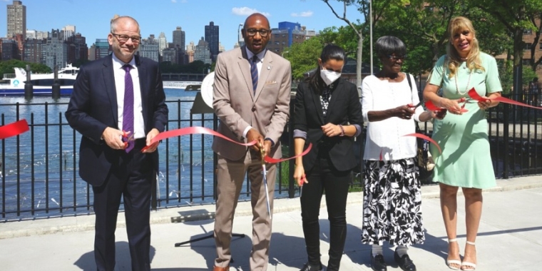 Elected officials and local leaders held a ribbon-cutting ceremony in front Hallets Cove Wednesday to mark the completion of a revitalization project along the shoreline.