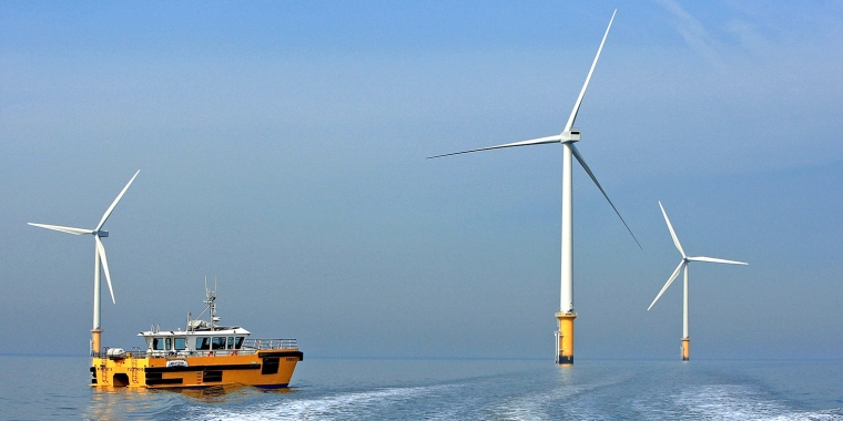 Fully Operational Wind Farm with Turbines and a Boat