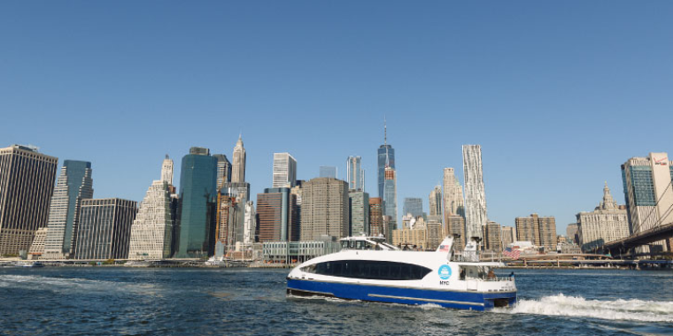 NYC Ferry with Manhattan in the background.