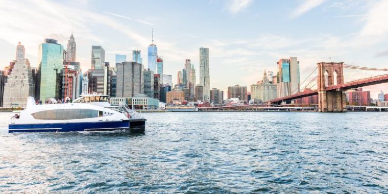 NYC Ferry with Manhattan in the background.
