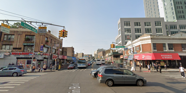 Cars going through the intersection at Sutphin Blvd &amp; Archer Avenue, Queens, NY