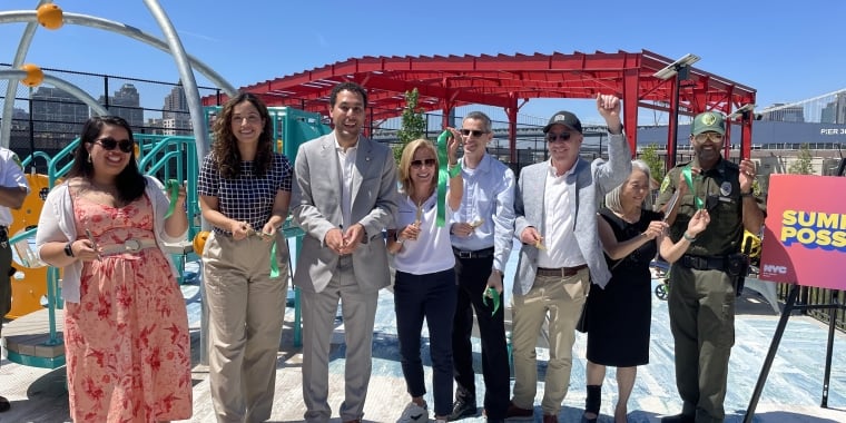 New York City Officials celebrate the opening of Pier 42 open space at a ribbon-cutting event.