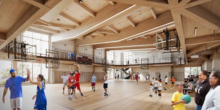 Interior rendering of Walter Gladwin Recreation Center, showing a spacious indoor basketball court filled with people playing and watching. Young players dribble and shoot balls while others engage in conversation. Overhead, a mezzanine level allows for additional viewing of the game. Mass timber beams support the ceiling.