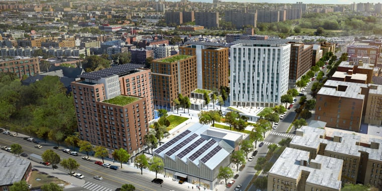 Aerial rendering of a Bronx neighborhood with several modern mid-rise apartment buildings, tree-lined streets, and The Peninsula with solar panels on its roof; surrounding area is densely built with other residential blocks. Rendering by WXY Architecture.