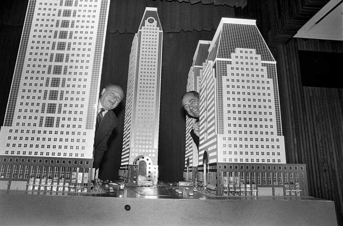 New York City Mayor Ed Koch and New York State Governor Mario Cuomo pose with scale replicas of the proposed four tower office development for 42nd Street and 7th Avenue. Some felt the uniformity of the buildings would change the character of the block. Credit: New York Times