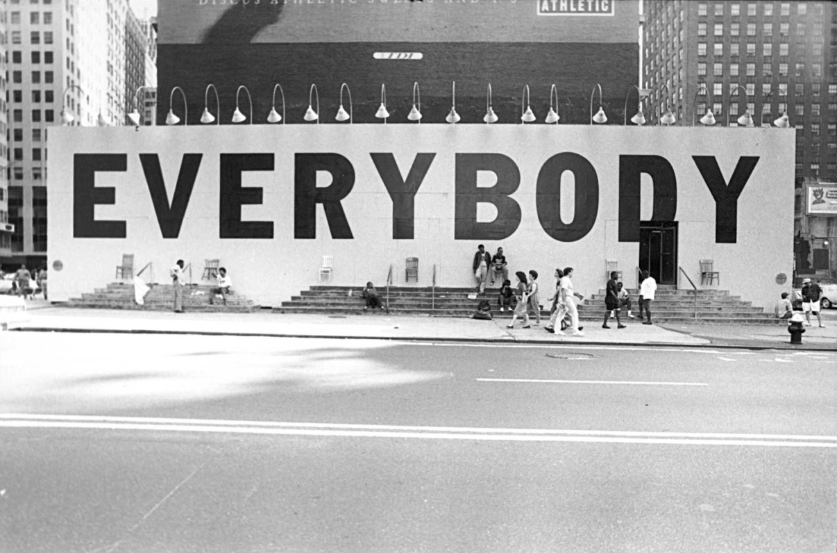 The famous “Everybody” billboard, designed by Tibor Kalman, that the 42nd Street Development project commissioned with Creative Time to bring people back to the block once the stores and buildings had been condemned. Credit: Maggie Hopp for Creative Time