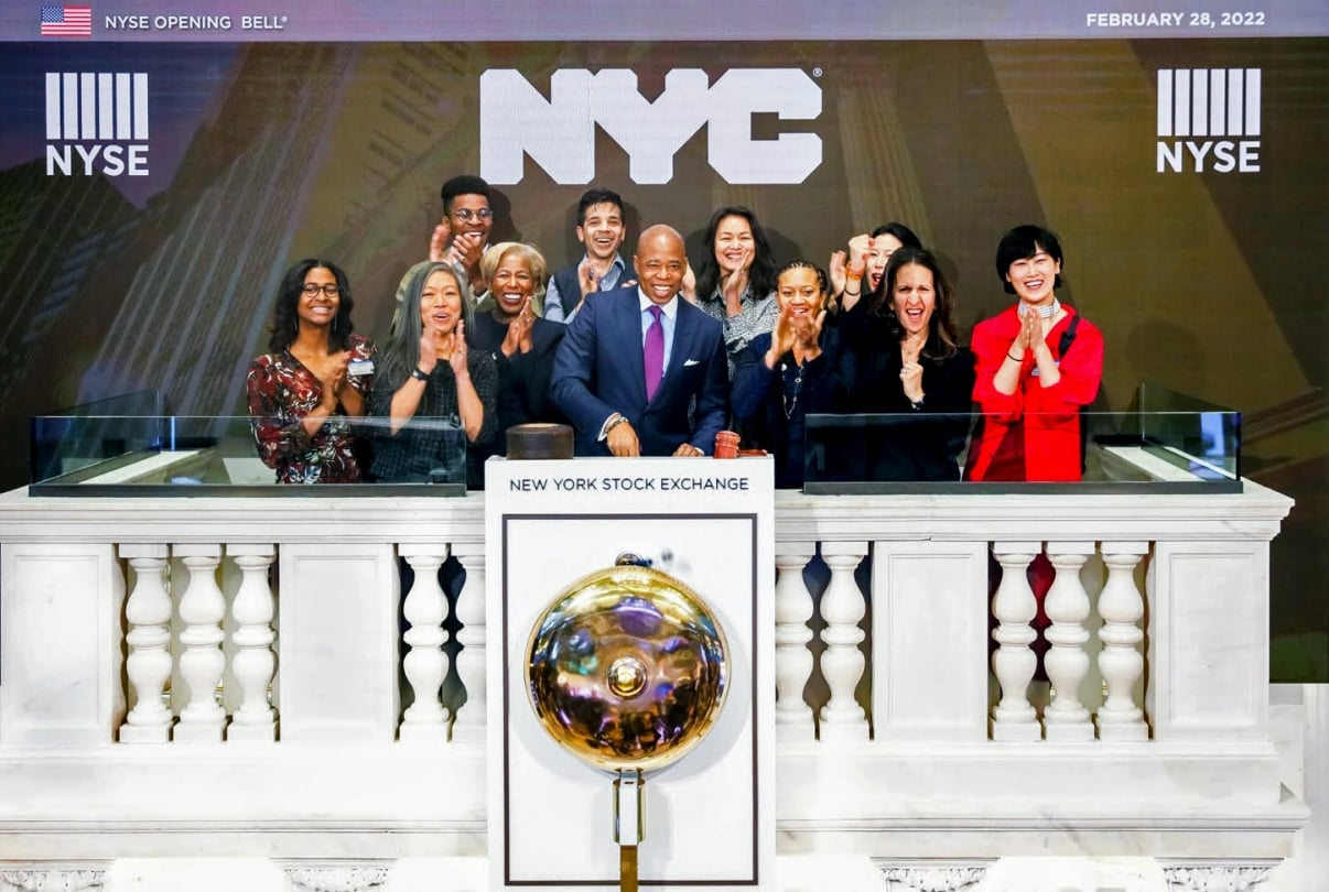 Mayor Adams and Founder Fellow teams ringing the NYSE Opening Bell event on February 28, 2022. They are standing together at the New York Stock Exchange podium, clapping and smiling. The NYSE and NYC logos are visible above them.