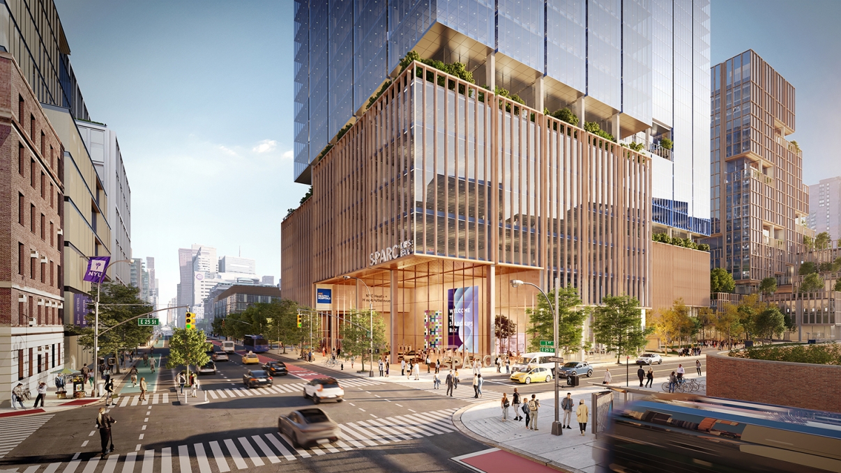 Rendering of the SPARC Kips Bay building. Street scene featuring a modern, glass skyscraper with wooden accents labeled SPARC KIPS. Busy intersection with pedestrians, cars, and a bus. Surrounding buildings are visible, and trees line the sidewalks under a blue sky.