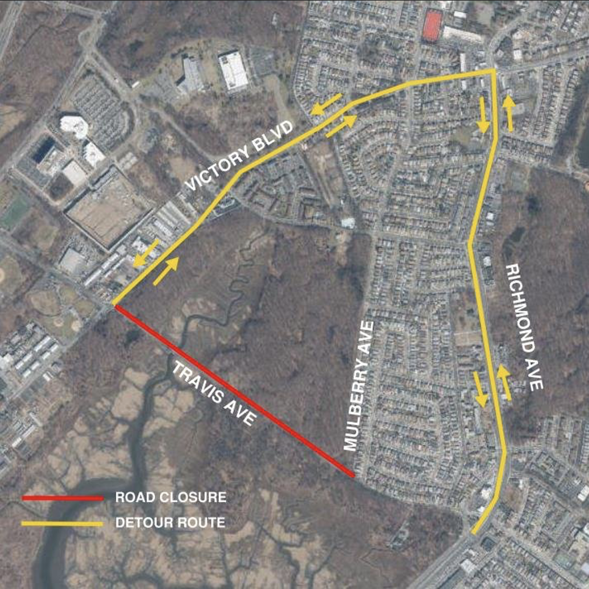 Aerial view of a road map showing a red line for road closure on Travis Ave. Yellow arrows indicate the detour route via Victory Blvd, Mulberry Ave, and Richmond Ave through a residential area.