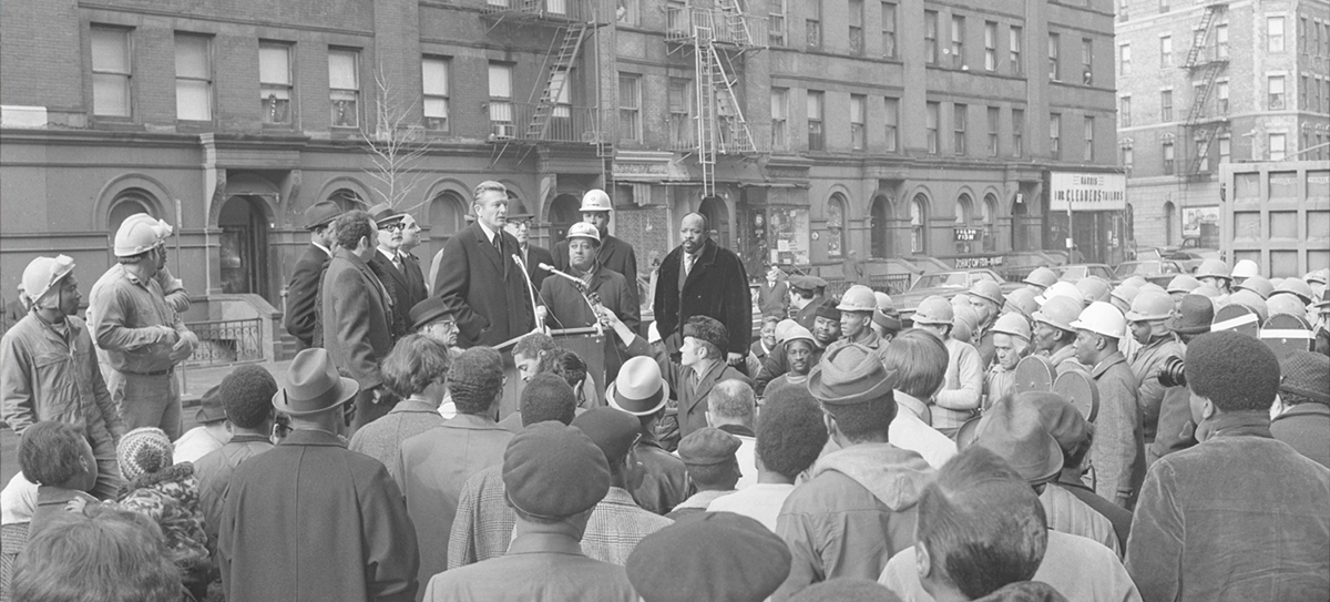 Mayor Lindsay, community members and construction workers at St. Nicholas Avenue and West 118th to announce the rehabilitation of the Garden Court apartment building. Mayor Lindsay, community members and construction workers at St. Nicholas Avenue and West 118th to announce the rehabilitation of the Garden Court apartment building.