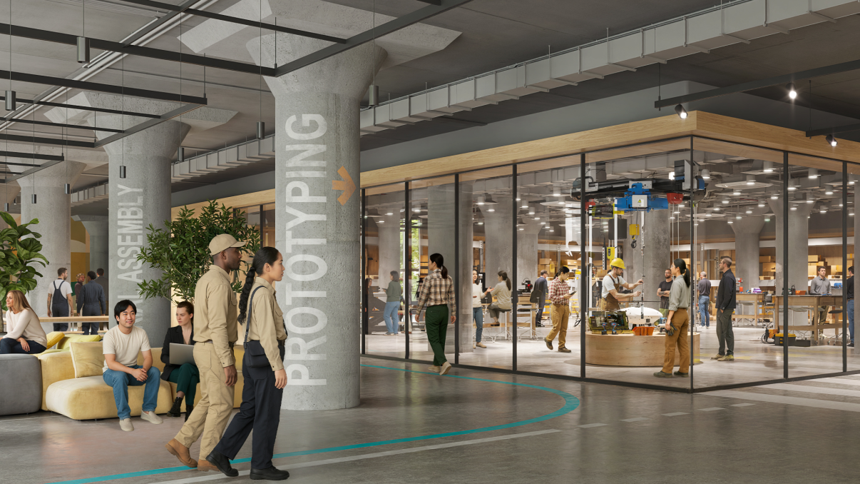 Interior rendering of BATWorks shows a modern, open-concept workspace with groups of people collaborating, lounge seating, glass-walled meeting rooms, and large labeled columns reading ASSEMBLY and PROTOTYPING. Some people are working, walking, or talking. Interior rendering of BATWorks shows a modern, open-concept workspace with groups of people collaborating, lounge seating, glass-walled meeting rooms, and large labeled columns reading ASSEMBLY and PROTOTYPING. Some people are working, walking, or talking.
