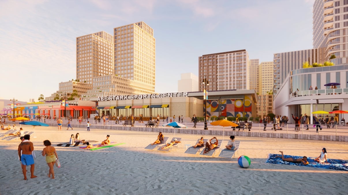 Rendering of Coney Island showing people relaxing on a sandy beach with umbrellas, towels, and a beach ball near a cityscape with tall buildings and Abe Stark Sports Center. The sky is clear, and the atmosphere is lively and sunny.