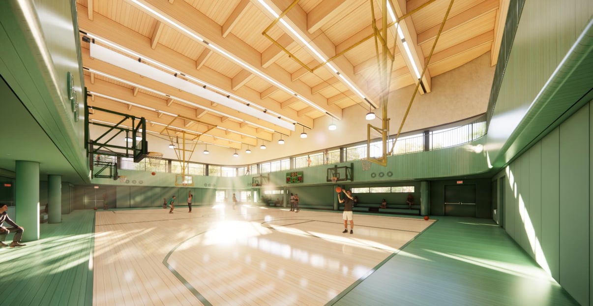 Interior render of Soundview Recreation Center shows a spacious indoor basketball court with high wooden ceilings, green walls, and natural light streaming through large windows. Several people are playing basketball while others sit and watch.